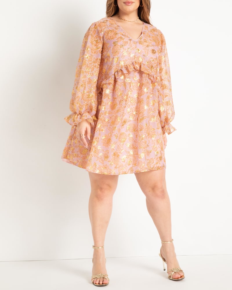Front of a model wearing a size 24 Clipped Jacquard Ruffle Mini Dress in Enchanted Floral Lavender by ELOQUII. | dia_product_style_image_id:275269